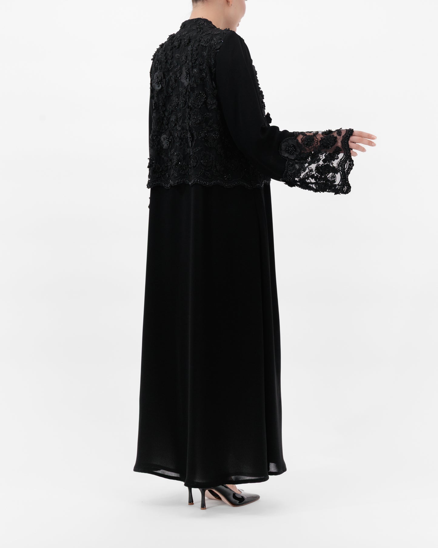 Black lace top and long black dress on a white background