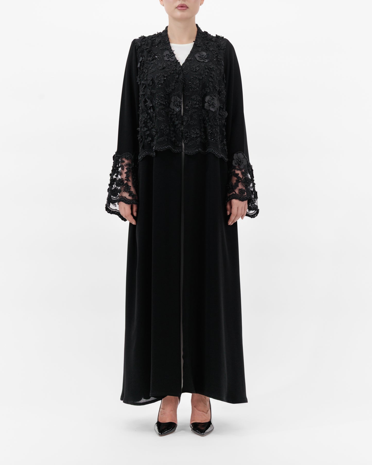 Black lace abaya on a white background