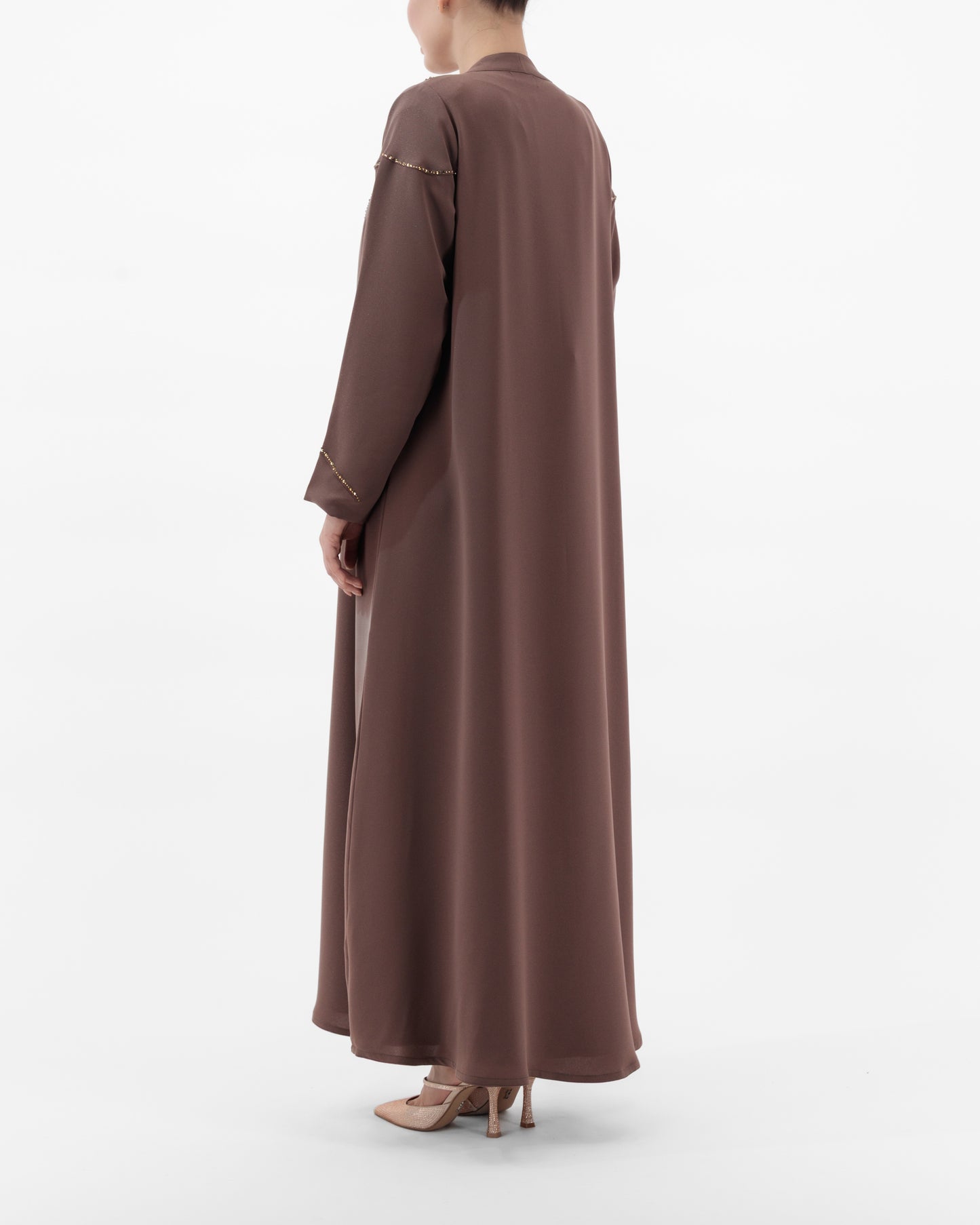 Brown long-sleeve dress worn by a person on a white background