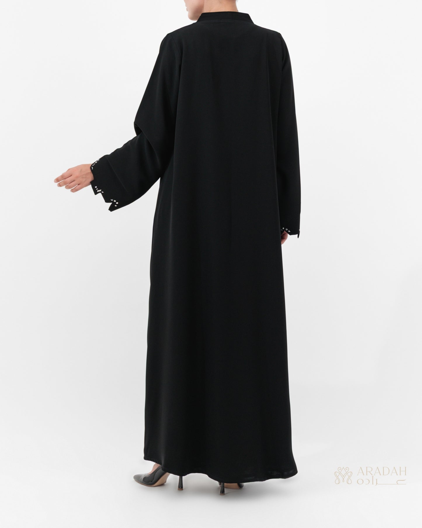 Scattered Silence abaya — front open over matching slip dress — styled look
