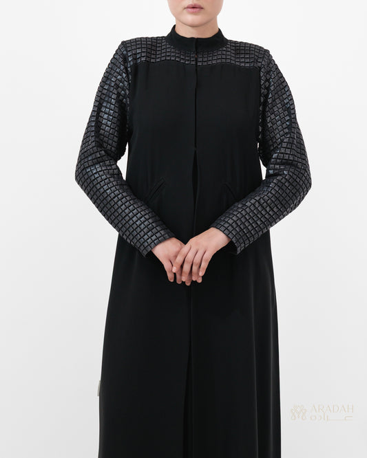 Grid Noir abaya — Turkish leather grid panels on shoulders — side profile
