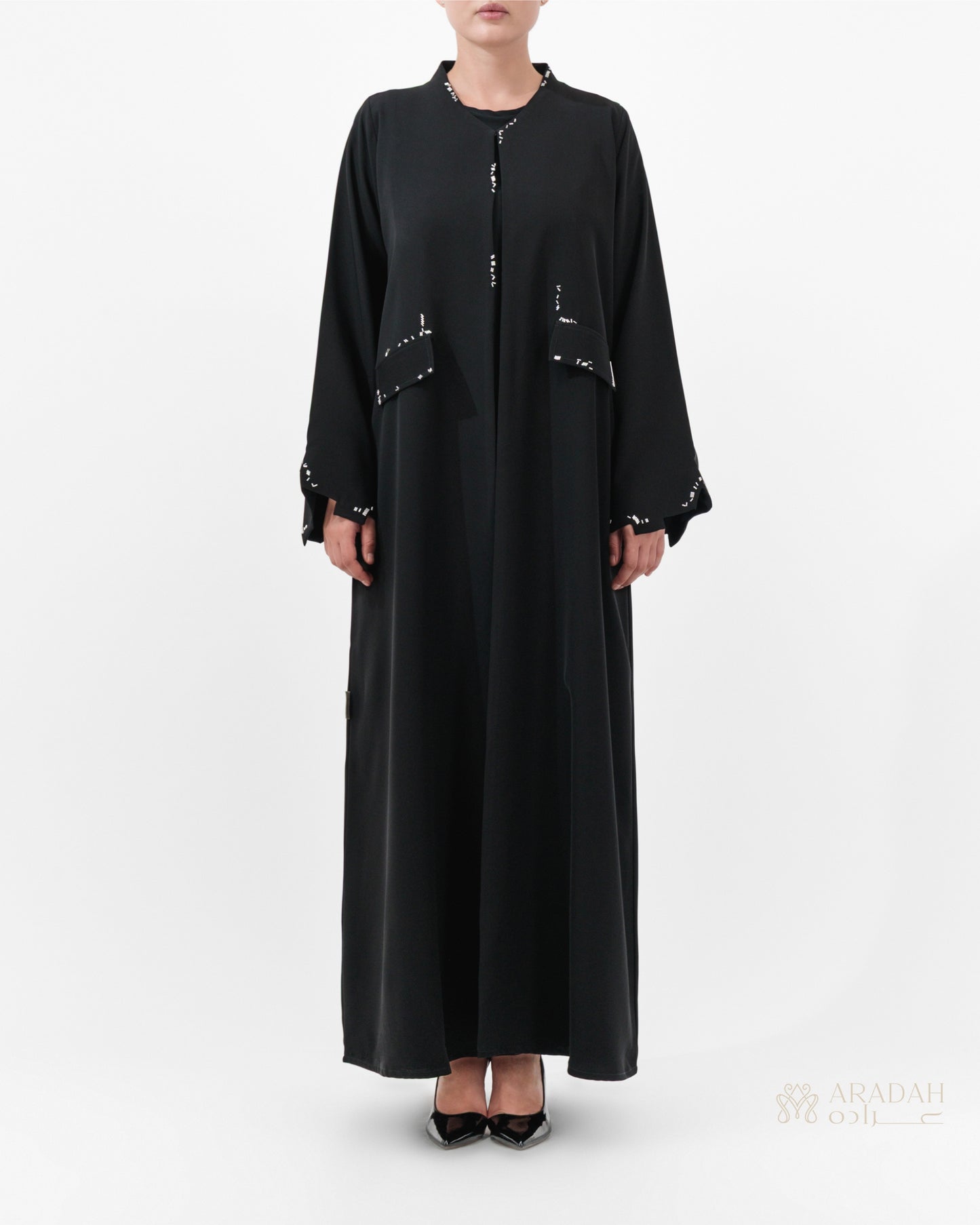 Scattered Silence abaya by Aradah — Nidha fabric — black — front view