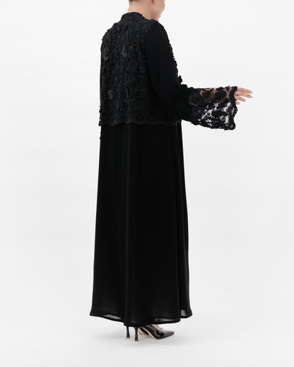 Black lace top and long black dress on a white background