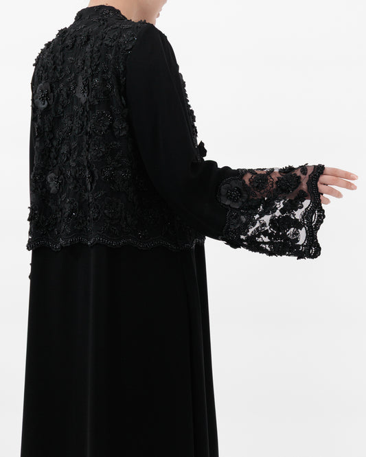 Black dress with lace sleeves on a white background