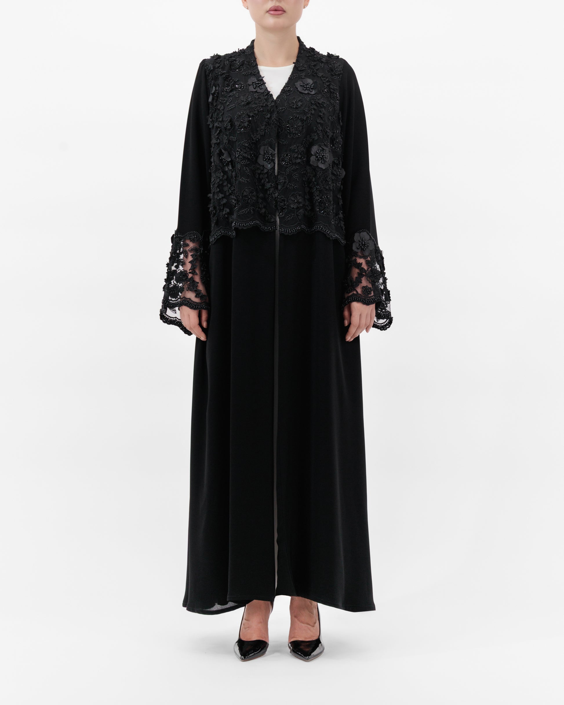 Black lace abaya on a white background
