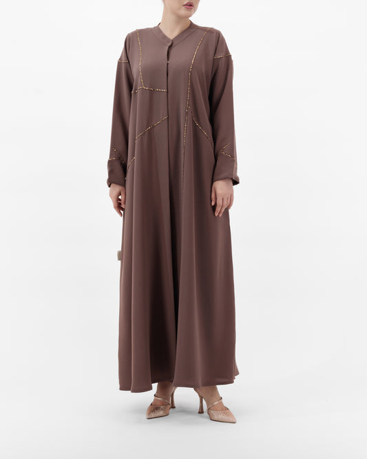 Brown long dress worn by a model on a white background