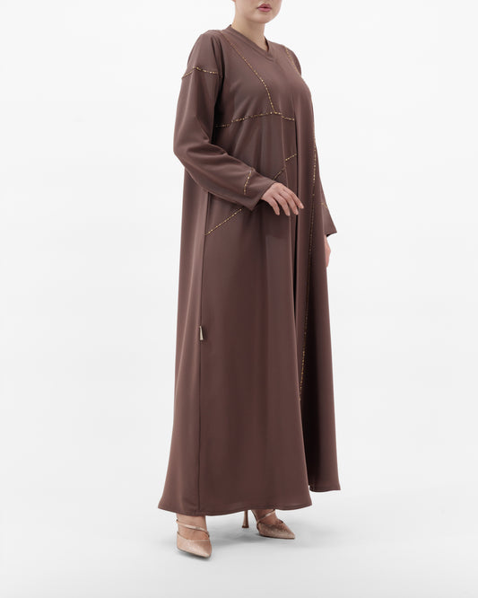 Brown long-sleeve dress worn by a person on a white background