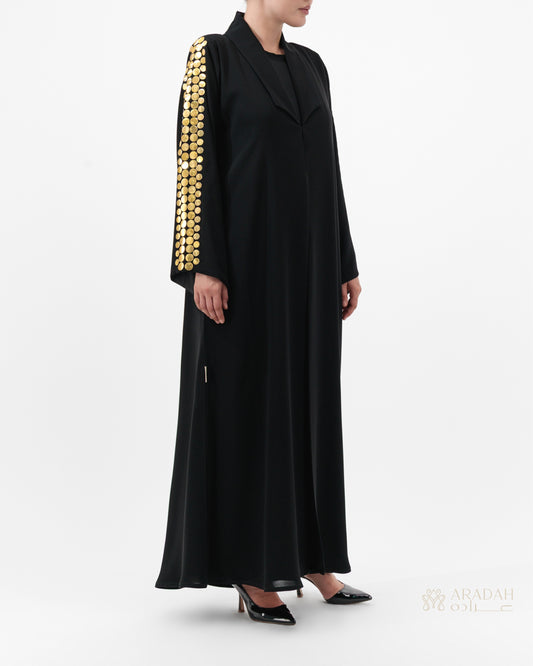 Helia abaya — Nidha — black — sleeve discs — side profile

