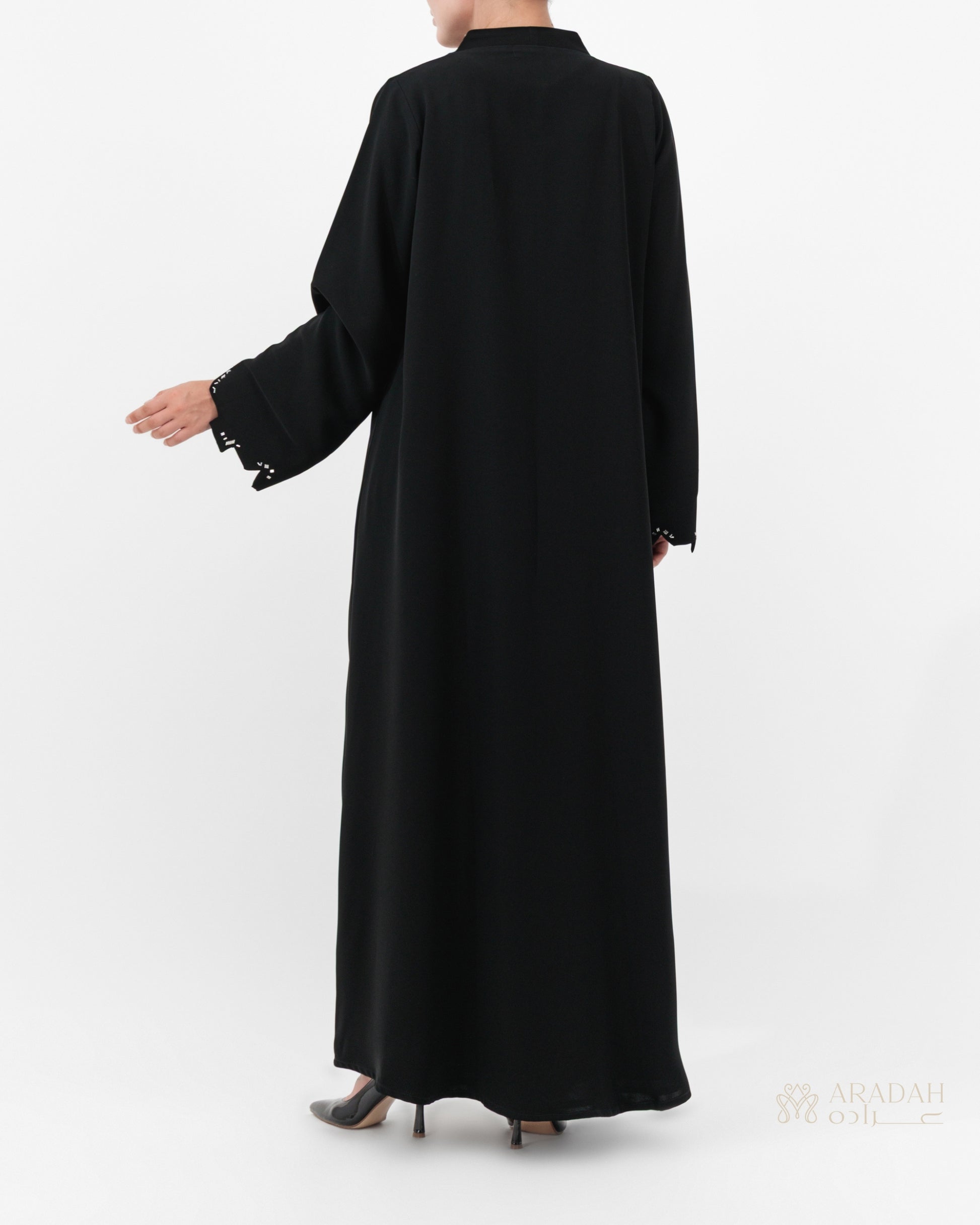 Scattered Silence abaya — front open over matching slip dress — styled look

