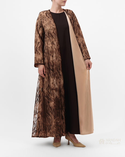 Sahara abaya — lace over satin — animal-inspired pattern — side profile

