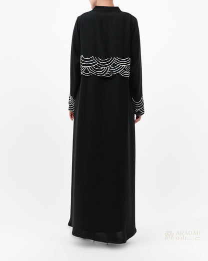 Regalia abaya — Nidha — black — cape-style overlay — back view

