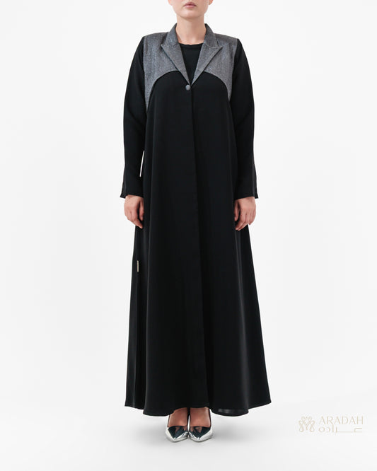 Black abaya with gray accents worn by a model on a white background