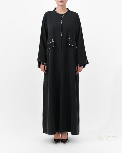 Scattered Silence abaya by Aradah — Nidha fabric — black — front view


