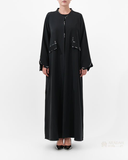 Scattered Silence abaya by Aradah — Nidha fabric — black — front view

