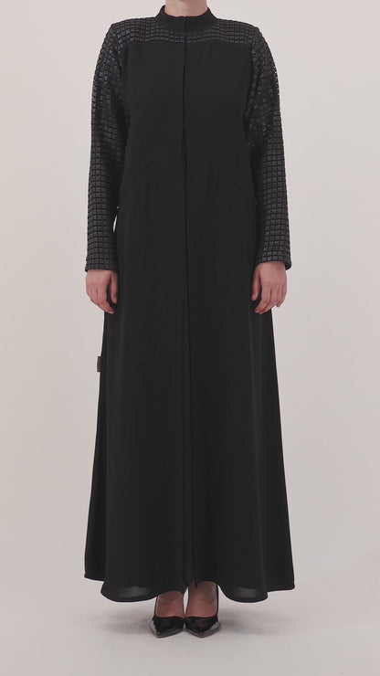 Grid Noir abaya — limited-edition leather grids — close detail

