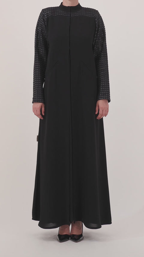 Grid Noir abaya — limited-edition leather grids — close detail

