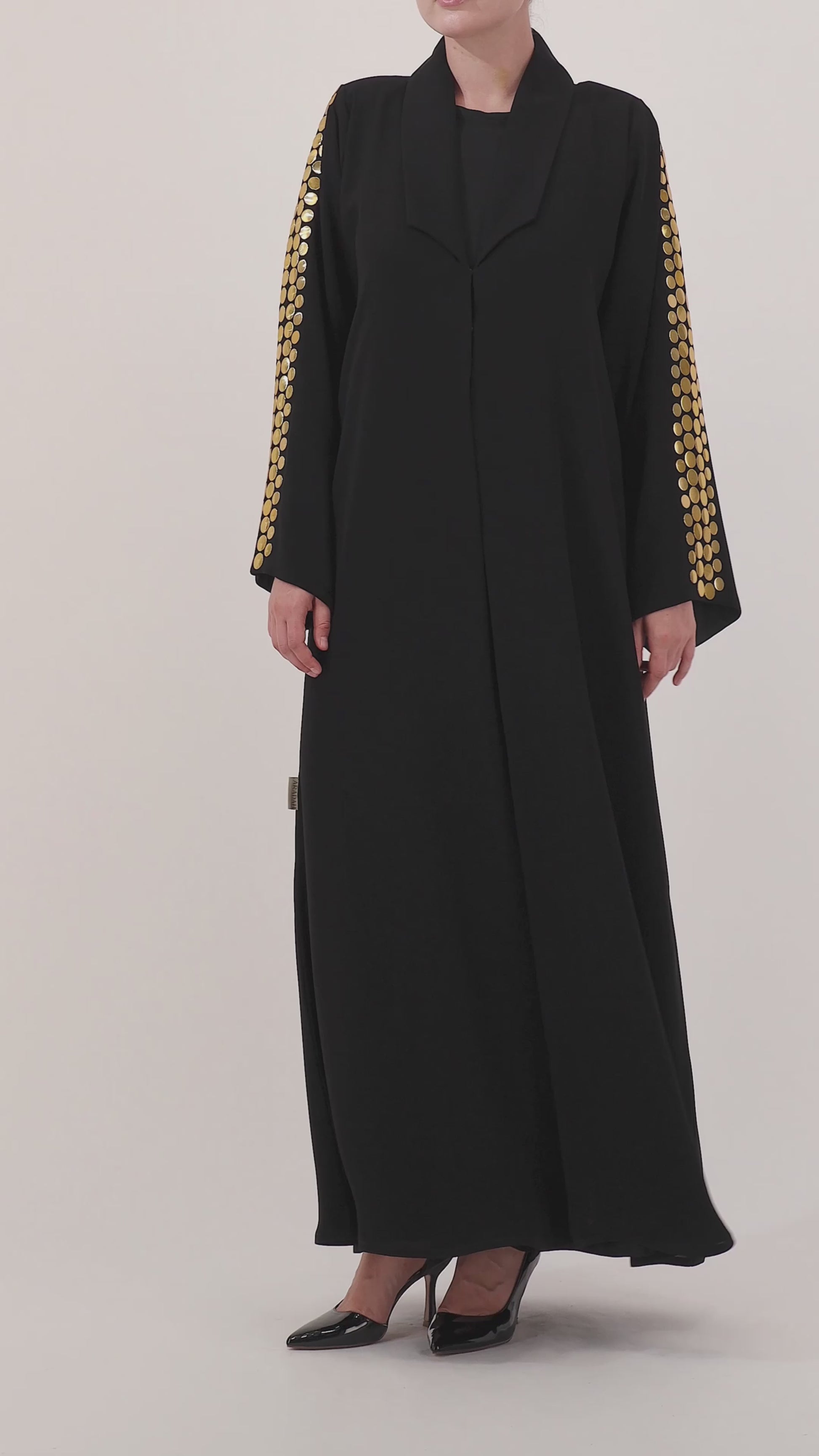Helia abaya — large hand-applied gold discs on sleeves — detail

