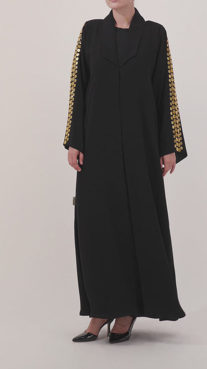 Helia abaya — large hand-applied gold discs on sleeves — detail

