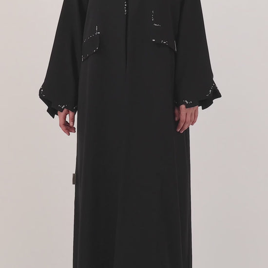 Scattered Silence abaya — product flat lay — full length

