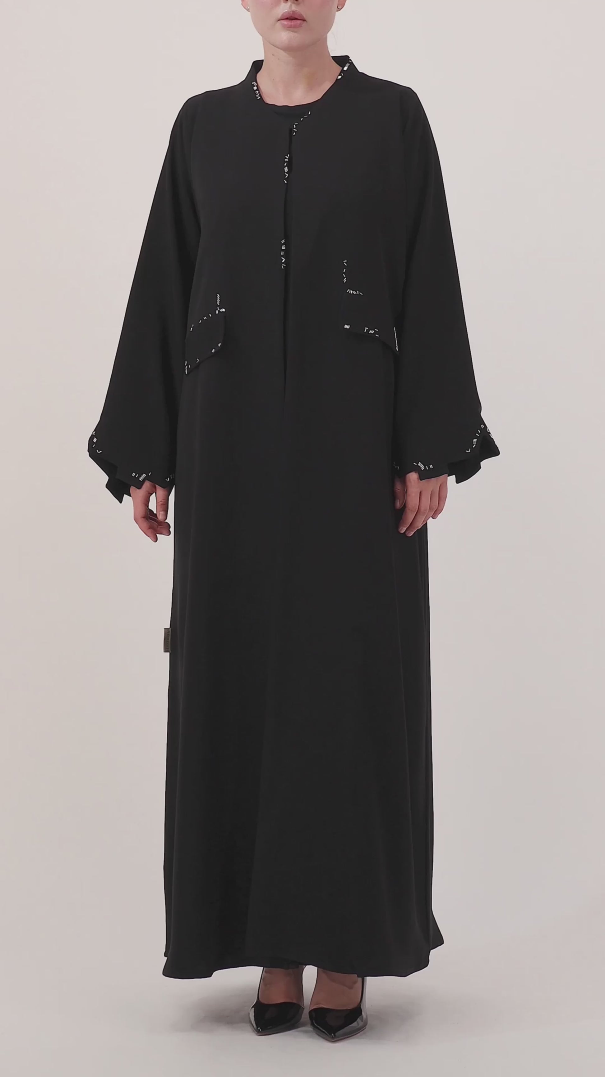 Scattered Silence abaya — product flat lay — full length

